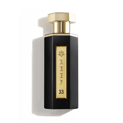 Black and gold perfume bottle labeled 'REEF 33' on a white background